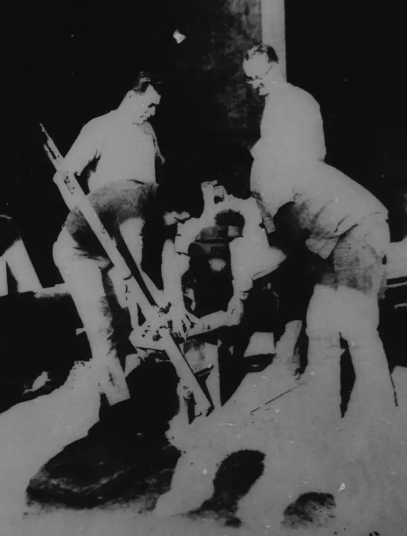 From the thesis, an image depicts students working on the process of forming the earth blocks.
