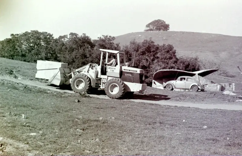 Historical photo of the transformer being carried up the canyon road.