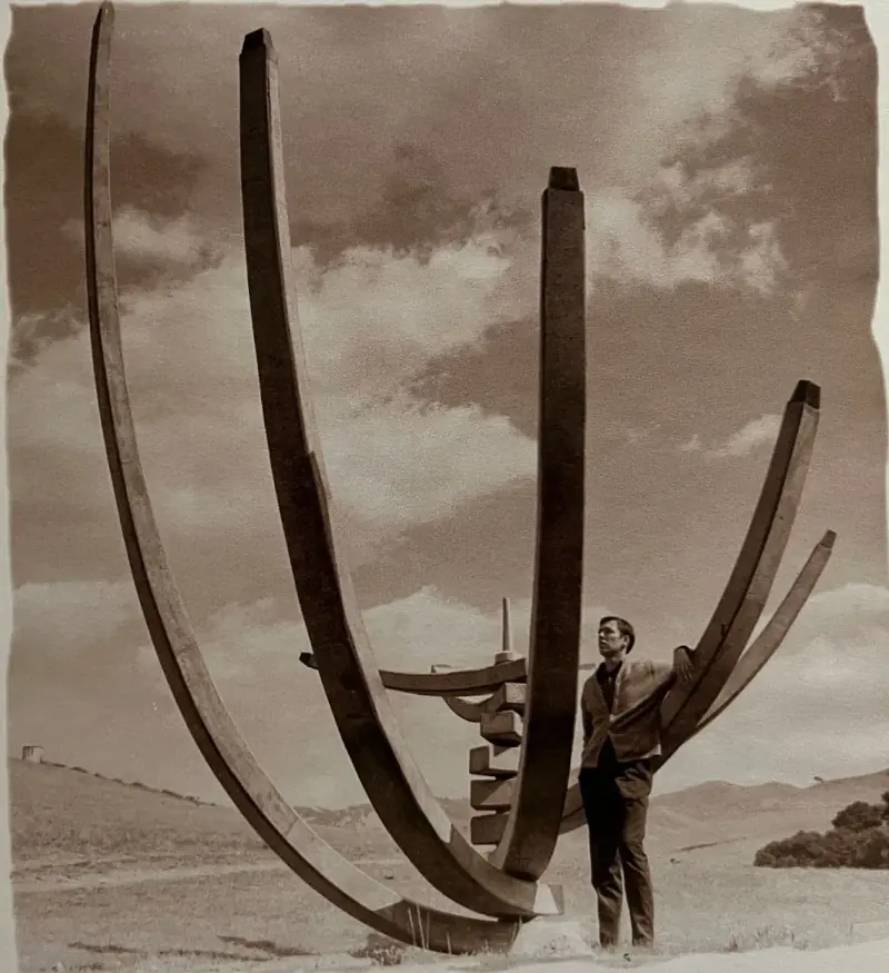 George Hasslein posing with the original Blade structure in an aesthetic photo.