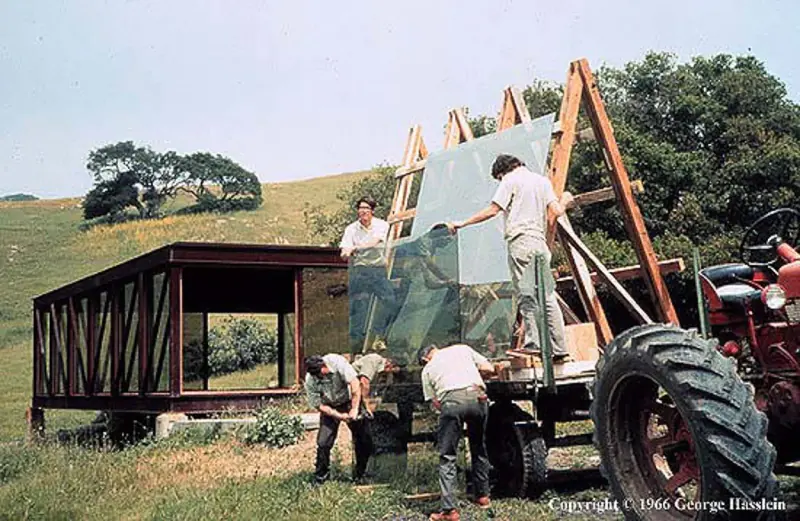 1966 photo of students installing glass into the bridge house.