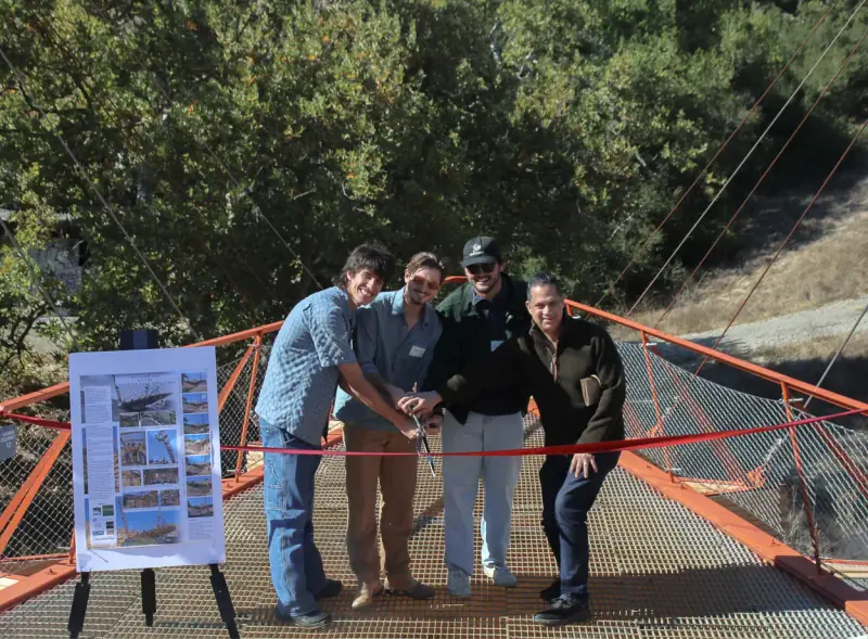 Renovation team cutting the ribbon with original builder Ronan.