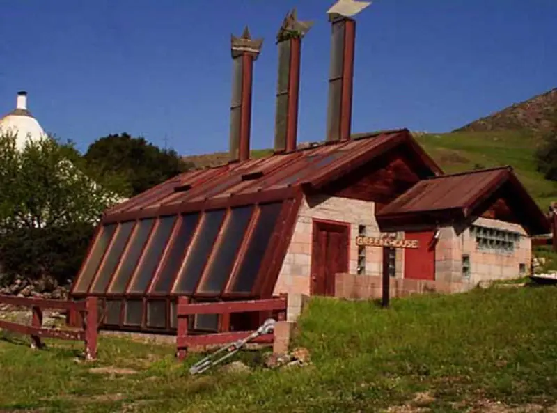 A pristine image of the greenhouse in its full form, undamaged.