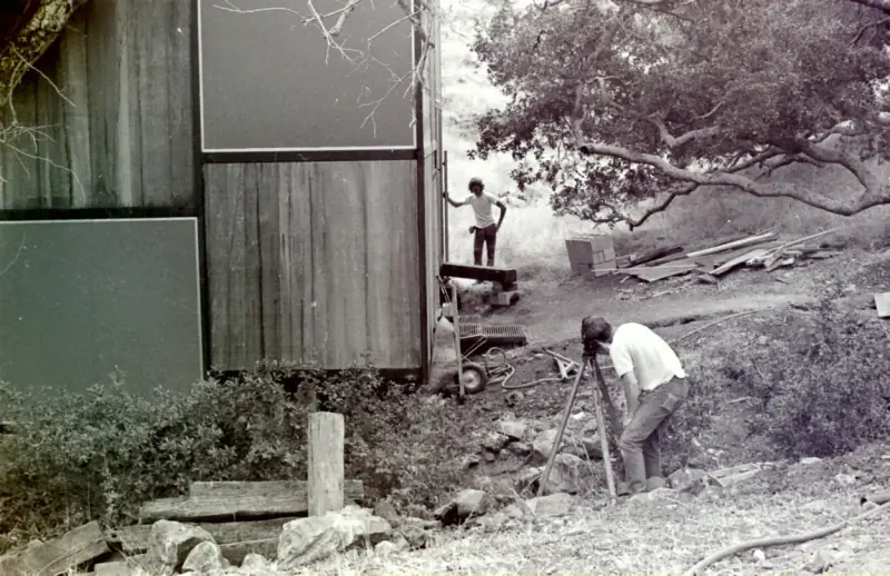 Surveying during the original construction phase.