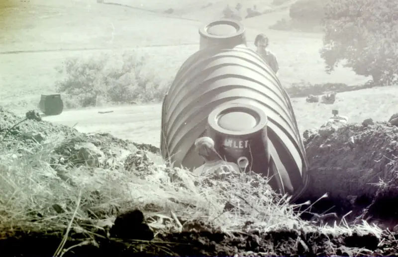 Septic tank being installed for the modular house, still in place today.