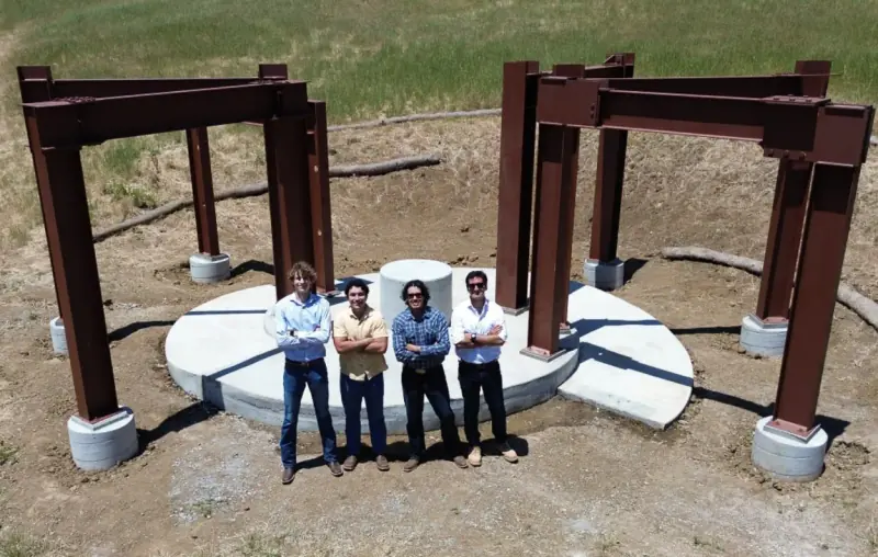 The finished monument, with the crew posing in front.