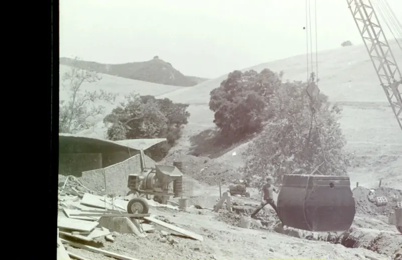A massive septic tank being installed, highlighting the scale of the project.
