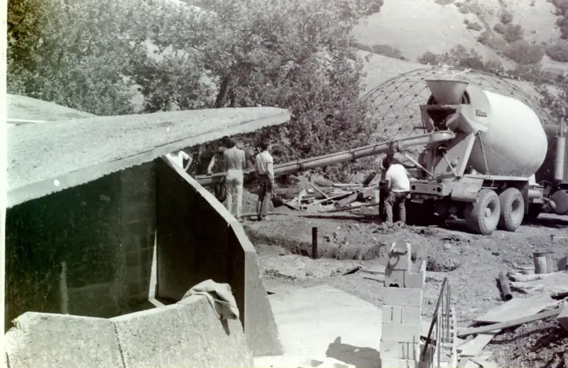 Cement truck filling in some of the final work, with the Dome seen in the background.