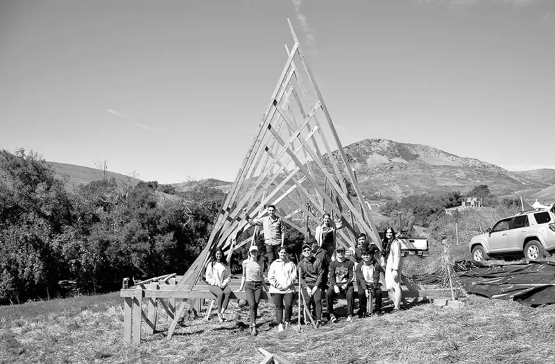 The design build team posing in front of the finished structure.