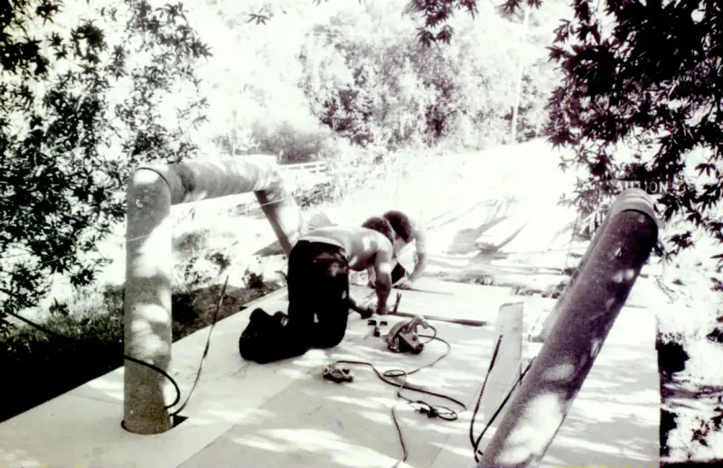 Historical image of construction on the bridge walkway.