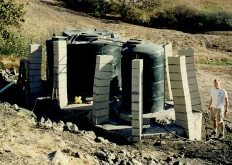 Student posing in the middle of the 1998 expansion project.